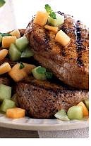 Associated Press Jamaican Pork Chops With Melon Salsa benefit from the jerk seasoning that gives the grilled chops their zesty bite.