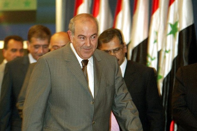 Iraqi Prime Minister Ayad Allawi walks away after a press conference in Baghdad, Iraq, Saturday, Aug. 7, 2004. Allawi discussed why the Iraqi government had closed the Iraqi offices of Al-Jazeera for 30 days, accusing the pan-Arab television station of inciting violence. Government ministers have grown increasingly critical of the television station in recent weeks. (AP Photo/Jim MacMillan)