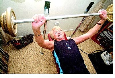 Rick Gunn/Nevada Appeal Rita Plank, who competed in the Senior Olympics and Senior Games, works out at her home in May 2004.