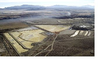 Associated Press Evaporation ponds at the northeast end of an abandoned copper mine in Yerington are shown in this aerial photo taken Jan. 28. Under pressure from Sen. Harry Reid, D-Nev., and the Environmental Protection Agency, Gov. Kenny Guinn is signaling a new willingness to reconsider his opposition to declaring the abandoned mine a U.S. Superfund site.