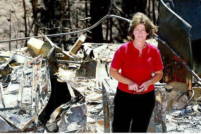 Belinda Grant/Nevada Appeal Mary Ann Randall stands in the middle of what used to be her and her husband Brian&#039;s, home on Timberline Drive.