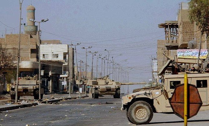 American soldiers patrol the besieged southern Iraqi city of Najaf, Wednesday Aug. 18, 2004. (AP Photo/Khalid Mohammed)