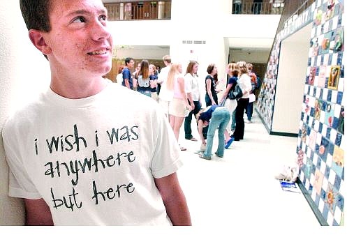 Daniel Scarbrough expresses his sentiments to a &#039;T&#039; during the first day of school at Carson High School on Tuesday. At top, Carson High School students whir around Senator Square on Tuesday.     Rick Gunn Nevada Appeal