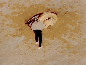 This image from television shows a man approaching the Genesis space capsule after it crashed in Utah&#039;s western desert at the Dugway  Proving  Ground, Wednesday, Sept. 8, 2004. (AP Photo/NASA TV)