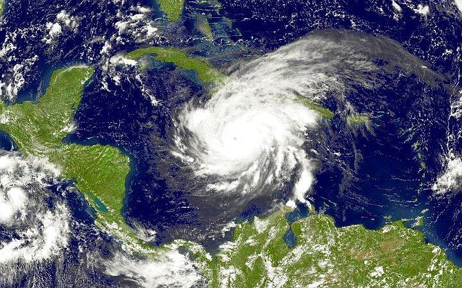 Hurricane Ivan is seen in this NOAA satellite image taken at 1:15 p.m. EDT, Friday, Sept. 10, 2004, as it bears down on Jamaica. Ivan&#039;s deadly winds and monstrous waves bore down on Jamaica on Friday, threatening a direct hit on its densely populated capital after ravaging Grenada and killing at least 33 people. (AP Photo/NOAA)