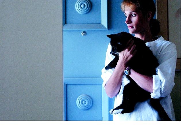 Rick Gunn/Nevada Appeal Leukemia patient Brenna Rankin stands near the door of her home in Gardnerville with her cat,  Shadow.