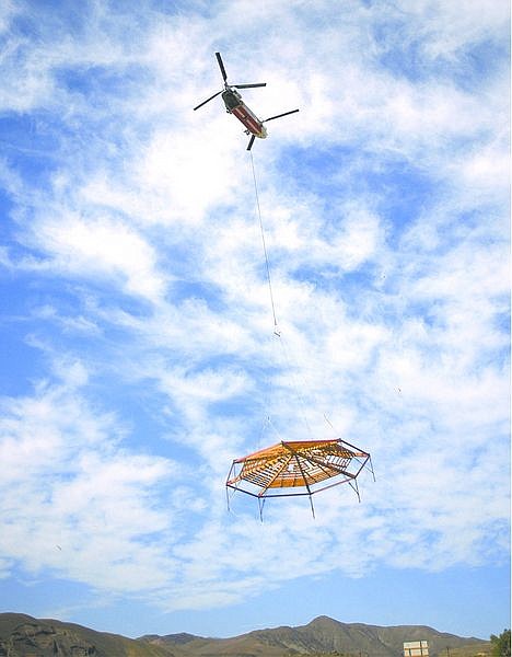 The central parlor section is airlifted to the new site of the Mustang Ranch brothel east of Reno, Nev., Sunday, Sept. 12, 2004. The famous brothel is being re-opened at a new site by new owner Lance Gilman. (AP Photo/Debra Reid)