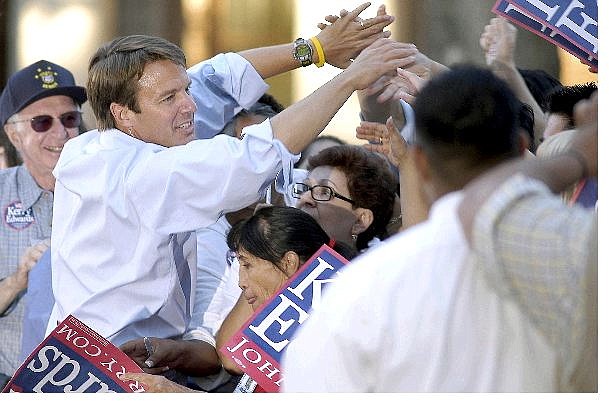 Debra Reid/Associated Press Democratic vice presidential candidate John Edwards greets supporters after a campaign appearance Monday at the University of Nevada in Reno. Top, supporters await Edward&#039;s arrival at UNR.