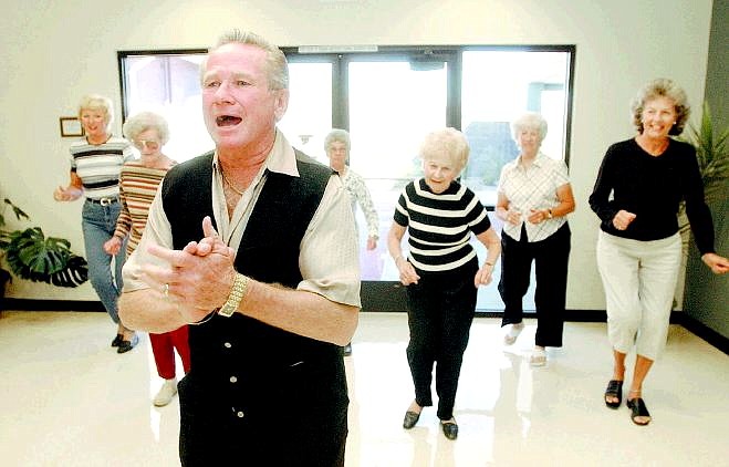Rick Gunn/Nevada Appeal Thane Cornell instructs a group of dancers at the Carson City Senior Citizens Center on Friday. Cornell will offer dance lessons prior to monthly community dances at the center.