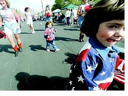Hannah Lewis, 4, front, and her sister Hailey, 3, of Dayton, entertain parade-goers with the Dayton Dukettes during the Dayton Valley Days parade in 2004. (Photo: Brad Horn/Nevada Appeal)