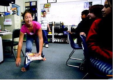 Brad Horn/Nevada Appeal Walking into science class Thursday morning 12-year-old Bree Young trips, spilling her books on the floor. The staged scenario was part of Carson Middle School&#039;s first project SAFE, a day dedicated to teaching students how to prevent and respond to bullying.