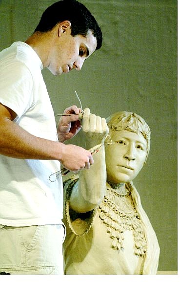 Cathleen Allison/Nevada Appeal Artist Benjamin Victor works on the Sarah Winnemucca statue at the State Library and Archives Gallery on Monday morning. The finished bronze will be placed in the National Statuary Hall in Washington, D.C.