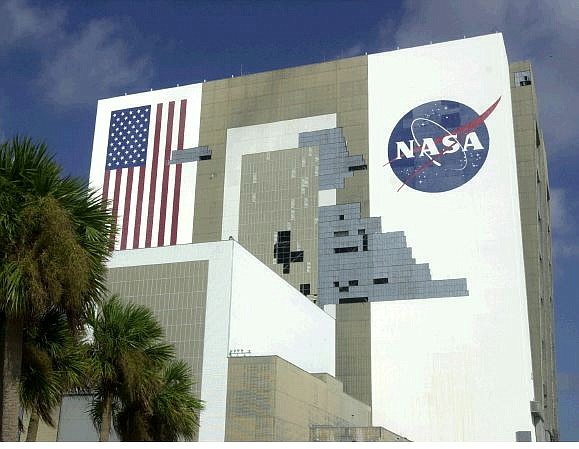Missing panels can be seen on the Vehicle Assembly Building at the Kennedy Space Center in Cape Canaveral, Fla. Tuesday, Sept. 28, 2004. The combined impact of hurricanes Frances and Jeanne on the VAB caused some 850 panels to be torn loose. (AP Photo/Peter Cosgrove)