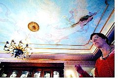 BRAD HORN/Nevada Appeal Joyce Harrington talks about local artist Karen Pecorilla and her &#039;Blissful Angel&#039; mural on the ceiling at the Bliss Mansion.