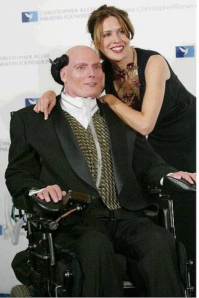 ** FILE ** Christopher Reeve poses for photographers with his wife Dana as he arrives at the 13th annual Christopher Reeve Paralysis Foundation gala event in New York,  in this Nov 24, 2003 file photo. Reeve, the star of the &quot;Superman&quot; movies whose near-fatal riding accident nine years ago turned him into a worldwide advocate for spinal cord research, died Sunday, Oct. 10, 2004, of heart failure while at his New York home, his publicist said. He was 52. (AP Photo/Stuart Ramson, File)