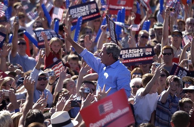 President Bush waves to the crowd during a campaign rally Thursday, Oct. 14, 2004, at Rancho San Rafael Park in Reno, Nev. (AP Photo/Liz Margerum, Pool)