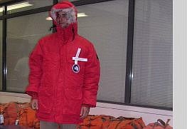 by Karl Horeis Ezra Hohmlund of Portland, Ore., who will be  a cook for the next four months at McMurdo Station in Antarctica, tries on the giant red parka supplied for him by RaytheonPolar Services.