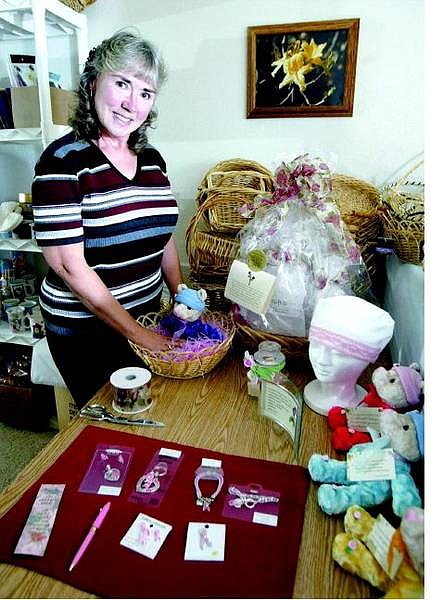 Jim Grant/Nevada Appeal News Service Judi Sparrow displays items used in the Chemo Buddies gift baskets.