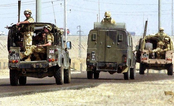 British troops leave the center of Basra, southern Iraq, Thursday, Oct 21, 2004. Britain said Thursday a battalion of British troops would be redeployed into volatile central Iraq, meeting a U.S. request despite strong opposition within the governing Labour Party. (AP Photo/Nabil Al Jurani)