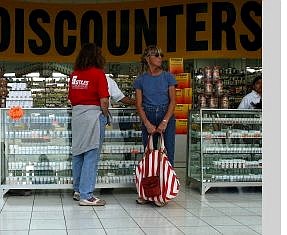 Associated Press Two unidentified American women shop at a drug store in Tijuana, Mexico, on Monday. Americans desperate for the vaccine are coming to pharmacies across the border and are often being turned away.