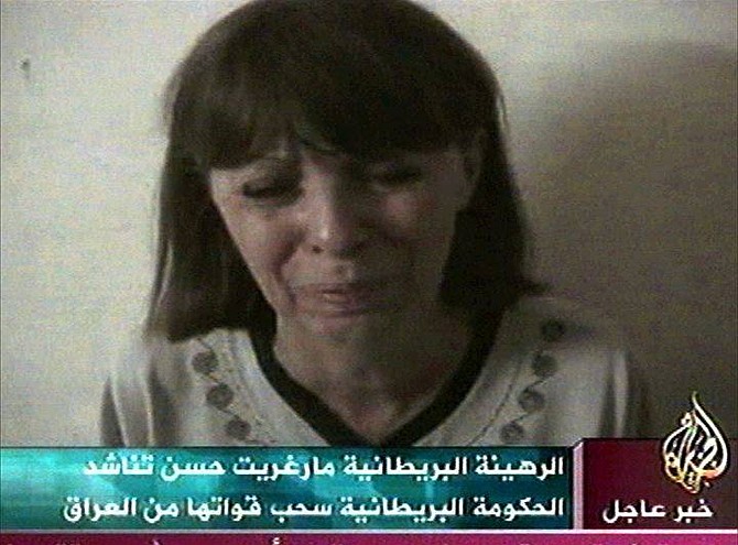 Margaret Hassan, the kidnapped director of CARE International in Iraq, appears in this image made from television in a  videotape aired by the Arabic television station Al-Jazeera, Friday, Oct. 22, 2004. Hassan is seen weeping and pleading for British Prime Minister Tony Blair to withdraw troops from Iraq and not bring them to Baghdad because this might be my last hours. She said she might be killed like British hostage Kenneth Bigley, who was beheaded by his captors earlier this month.  (AP Photo/Al-Jazzera via APTN)  ** TV OUT  **