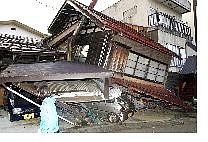 A house in Tokamachi City, northwest of Tokyo, was damaged by a barrage of powerful earthquake that hit the area Saturday.