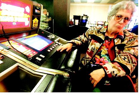 Winnie Canoro sits at a nickel slot machine at Slot World on Sunday  afternoon.      BRAD HORN Nevada Appeal