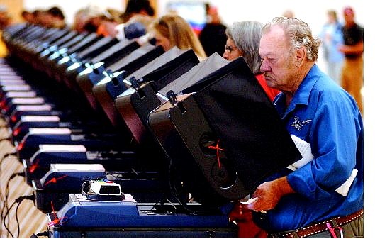 Rick Gunn/Nevada Appeal Hershel Baker of Carson City casts his vote Tuesday at the Community Center.