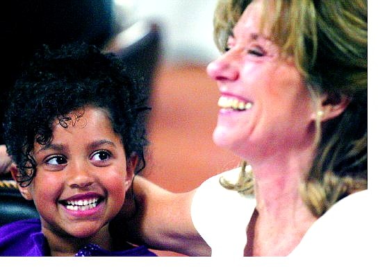 BRAD HORN/Nevada Appeal Maya Claiborne, 6, laughs with her grandmother Gaynel Henstad at the Harvesting Hope fashion show at the Carson Nugget on Sunday. Maya had kidney cancer when she was 19 months old, and her grandmother is a colon cancer survivor. Maya&#039;s great aunt Ricka Benum also beat the disease.