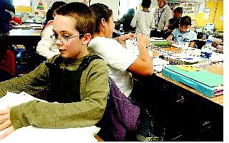 Josh Davis, 10, a fourth-grader at Empire Elementary, sits in Ingrid Frenna&#039;s class. Officials say Carson City School District is doing well in terms of teacher-to-student ratio.  Rick Gunn Nevada Appeal