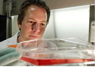 AssociatedPress University of California, Irvine, researcher Hans Keirstead holds a special bottle with human embryonic stem cells Dec. 7 in his lab at the Gillespie Neuroscience Research Facility in Irvine, Calif. In his cramped labs, paralyzed rats have been made to walk with stem cell injections.