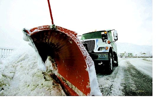 Brad Horn/Nevada Appeal A Carson City snow plow clears a street in Kingsington Park on Friday.