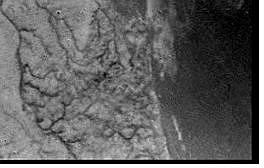 ** RETRANSMISSION TO ADD CAPTION INFORMATION ** This is a European Space Agency image from the ESA&#039;s webside taken on Friday Jan. 14, 2005, after the Huygens space probe beamed data including this image back to earth through its Cassini mothership orbiting Saturn&#039;s moon Titan. This is one of the first raw images returned by the ESA Huygens probe during its successful descent. It was taken from an altitude of 16.2 kilometers (about 10 miles) with a resolution of approximately 40 meters (about 131 feet) per pixel. It apparently shows short, stubby drainage channels leading to a shoreline. (AP Photo/European Space Agency/NASA) ** FOR EDITORIAL USE ONLY MANDATORY CREDIT: EUROPEAN SPACE AGENCY/NASA) **