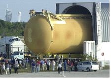 The new external fuel tank for the shuttle Discovery is wheeled out of the barge on the way to the Vehicle Assembly Building at Kennedy Space Center in Cape Canaveral, Fla., Jan. 6. Associated Press
