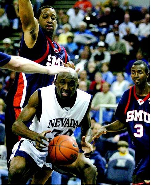 BRAD HORN/Nevada Appeal Nevada&#039;s Jermaine Washington goes up for a shot against SMU&#039;s Patrick Simpson and Justin Isham during the first half at Lawlor Events Center Thursday.