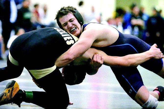 BRAD HORN/NEVADA APPEAL Travis Lamborn controls Galena&#039;s Nick Williams during their semi-final match at Galena High school on Saturday. Lamborn went on to win a gold medal in 160-pound weight class.