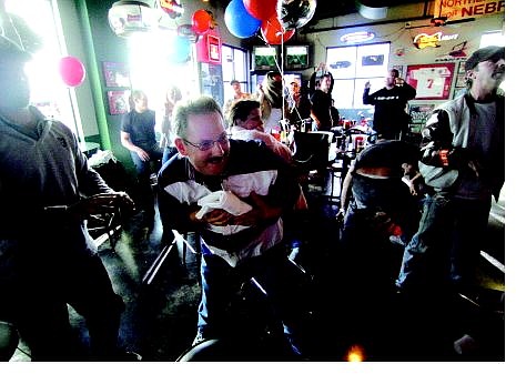 BRAD HORN/Nevada Appeal Dennis Kind, of Carson City catches a T-shirt thrown by one of the Bully&#039;s staff before the beginning of the sports bar&#039;s Super Bowl party Sunday.