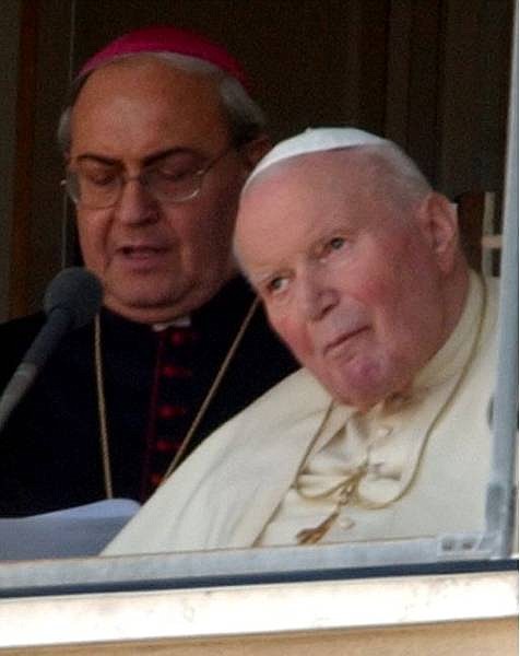 Pope John Paul II listens to Archbishop Leandro Sandri , left, reading the pontiff&#039;s address to the faithful from a window of Rome&#039;s Agostino Gemelli hospital, Sunday, Feb. 6, 2005. The 84-year-old pope was rushed to Gemelli Tuesday night with breathing problems. (AP Photo/Plinio Lepri)