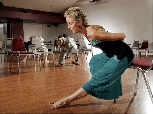 (AP Photo/Francis Specker)Yoga instructor Lakshmi Voelker-Binder, right, leads a chair yoga class, Jan. 20, 2005, at the Joslyn Senior Center in Palm Desert, Calif. An estimated 13.4 million Americans practiced yoga or other mind-body exercises in 2003, according to a survey by the Sporting Goods Manufacturers Association. Of those, an estimated 1.6 million were 55 or older.