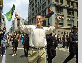 Diane Bondareff/Associated Press New York Mayor Michael Bloomberg carries a Brazilian flag and a rainbow flag symbolizing the gay pride movement as he marches in New York&#039;s Gay Pride Parade in this June 30, 2002, file photo.