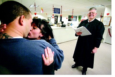 BRAD HORN/Nevada Appeal Michael and Anna Henson kiss after the Justice of the Peace Robey WIllis married the Carson City couple on Saturday morning at the Carson City courthouse.