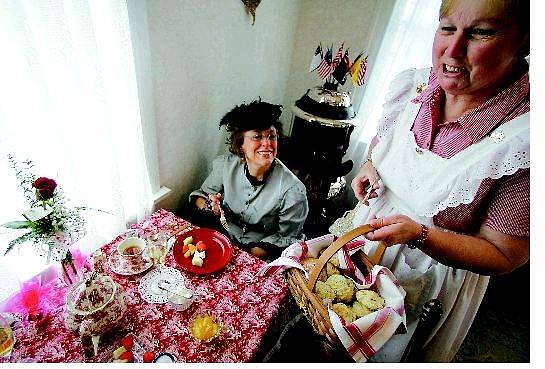 BRAD HORN/Nevada Appeal Patty Temple serves scones to Jan Rhoades&#039; table at the Roberts House Museum in Carson City on Sunday. Rhoades, a resident of Gardnerville, selected a blueberry scone.
