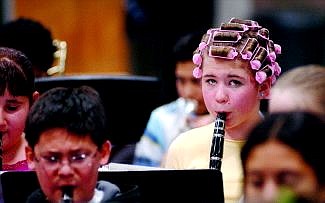 Rick Gunn/Nevada Appeal Haley Marriot, 11, of Eagle Valley Middle School was dressed in pajamas and curlers for this year&#039;s practice of Band-o-rama Wednesday morning. The all-school ensemble struck up their tune at 7 p.m. that night.