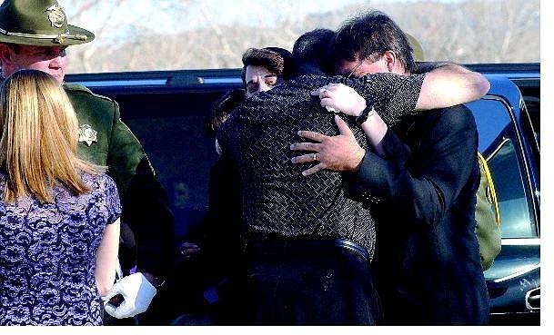 Rick Gunn/Nevada Appeal Matt and Lynette Putzer receive a conciliatory hug from a friend upon arriving at their 10-year-old son&#039;s memorial service at Carson Middle School. Hundreds of people attended the service for Brandon Matthew Putzer on Saturday.