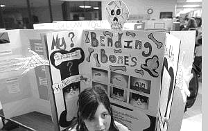 Rick Gunn/Nevada Appeal Shelby Parks stands in front of her third-place science project entitled &quot;Bending Bones.&quot; She was one of 100 students recognized at the 2004 Carson City School District Science Fair awards night at Western Nevada Community College on Wednesday.