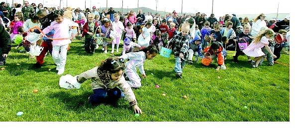 BRAD HORN/Nevada Appeal Children race to gather Easter eggs during the Jaycees&#039; 29th annual Easter egg hunt at Governor&#039;s Field Sunday. The 25,000-egg hunt is the largest in the state.