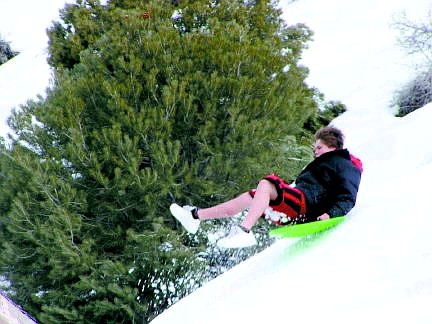 Chris Toll, 14, of Gold Hill, sleds down a hill near Rhode Island Street in February. The image waas taken by David Toll.