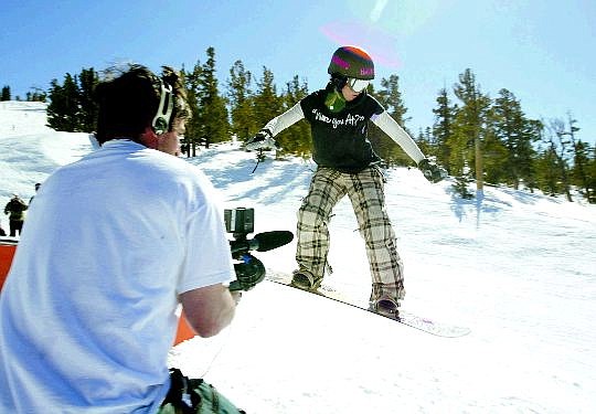 Dan Thrift/Nevada Appeal News Service MTV producer Francis Lyons, left, records Carson High student Amanda Barnes, 17, as she practices a box slide Thursday at Heavenly Mountain Resort. Barnes will be featured in the MTV show &quot;Made&quot; to air in early June.