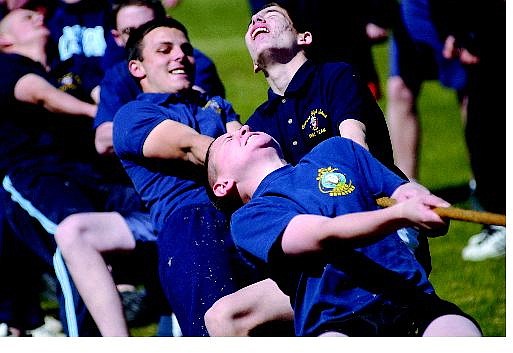 Rick Gunn/Nevada Appeal Carson High School NJROTC Andrew Stephenson, 16, struggles during tug-of-war competition at a field meet Wednesday.