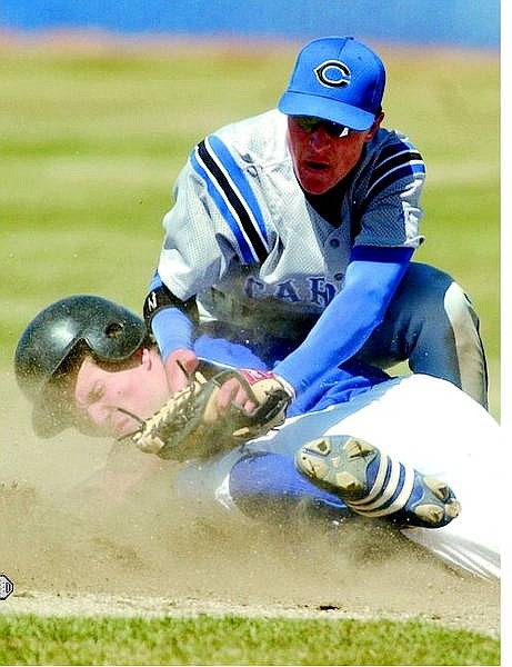 Carson Senator shortstop Kevin Schlange tags South Lake Tahoe Laker Ian Rice during their game at Ron McNutt Field in Carson City, Nev., on Saturday, April 16, 2005. Rice was safe on the play but the Senators won 15-4 in the first of a doubleheader. AP Photo Brad Horn/Nevada Appeal